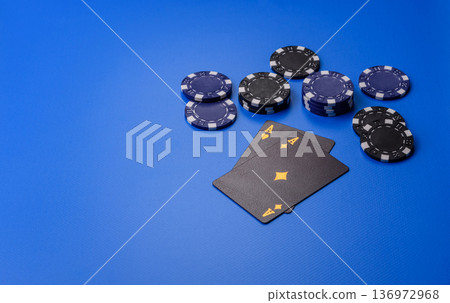 Casino, cards and chips on a colored background, poker and blackjack, gambling. Cards and chips Casino, cards and chips on a colored background, poker and blackjack, gambling. Cards and chips 136972968