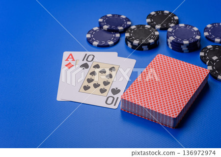 Casino, cards and chips on a colored background, poker and blackjack, gambling. Cards and chips 136972974
