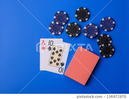 Casino, cards and chips on a colored background, poker and blackjack, gambling. Cards and chips Casino, cards and chips on a colored background, poker and blackjack, gambling. Cards and chips 136972978