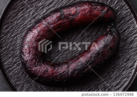 Homemade pork or beef sausage rings with garlic and spices. A homemade sausage ring Homemade pork or beef sausage rings with garlic and spices. A homemade sausage ring 136972996