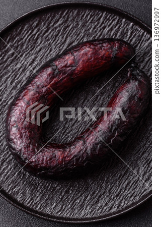 Homemade pork or beef sausage rings with garlic and spices. A homemade sausage ring Homemade pork or beef sausage rings with garlic and spices. A homemade sausage ring 136972997