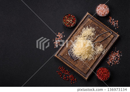 Grated Parmesan cheese as a cooking or baking ingredient. Grated Parmesan cheese Grated Parmesan cheese as a cooking or baking ingredient. Grated Parmesan cheese 136973134