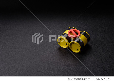 Metal barrels containing oil, gas, or chemicals, with a prohibition sign. Oil barrels 136973260