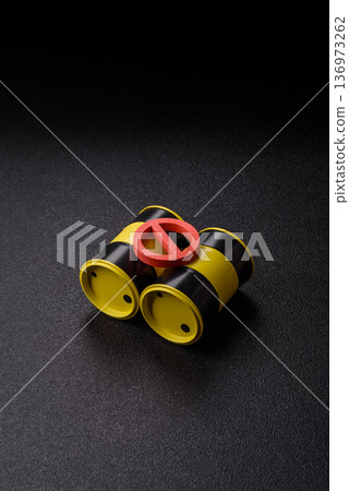 Metal barrels containing oil, gas, or chemicals, with a prohibition sign. Oil barrels 136973262