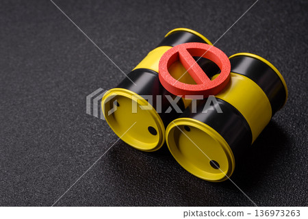 Metal barrels containing oil, gas, or chemicals, with a prohibition sign. Oil barrels 136973263