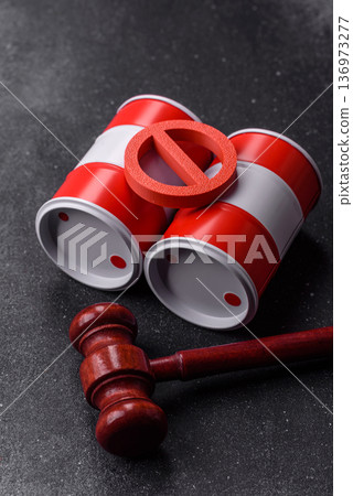 Metal barrels containing oil, gas, or chemicals, with a prohibition sign. Oil barrels 136973277