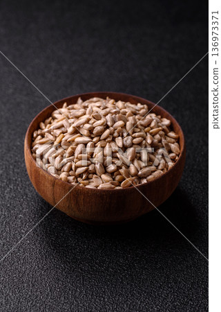 Shelled sunflower seed kernels, salted, roasted, or raw, are a healthy ingredient. Sunflower seeds Shelled sunflower seed kernels, salted, roasted, or raw, are a healthy ingredient. Sunflower seeds 136973371