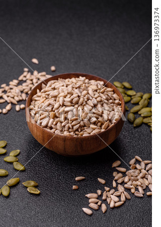 Shelled sunflower seed kernels, salted, roasted, or raw, are a healthy ingredient. Sunflower seeds Shelled sunflower seed kernels, salted, roasted, or raw, are a healthy ingredient. Sunflower seeds 136973374