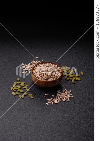Shelled sunflower seed kernels, salted, roasted, or raw, are a healthy ingredient. Sunflower seeds Shelled sunflower seed kernels, salted, roasted, or raw, are a healthy ingredient. Sunflower seeds 136973377