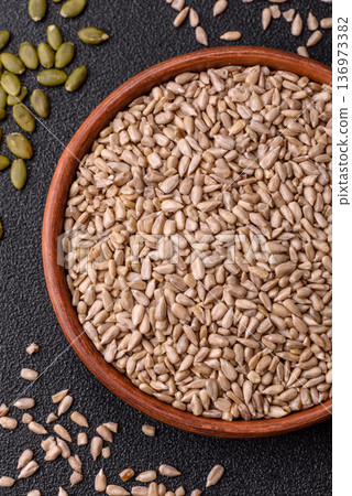 Shelled sunflower seed kernels, salted, roasted, or raw, are a healthy ingredient. Sunflower seeds Shelled sunflower seed kernels, salted, roasted, or raw, are a healthy ingredient. Sunflower seeds 136973382
