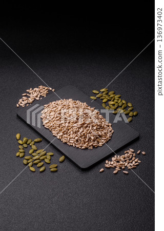 Shelled sunflower seed kernels, salted, roasted, or raw, are a healthy ingredient. Sunflower seeds Shelled sunflower seed kernels, salted, roasted, or raw, are a healthy ingredient. Sunflower seeds 136973402