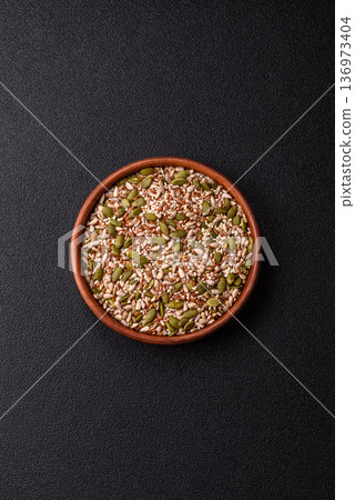 Shelled sunflower, sesame, pumpkin, and flaxseed kernels as ingredients for healthy food Shelled sunflower, sesame, pumpkin, and flaxseed kernels as ingredients for healthy food 136973404