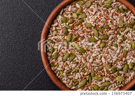 Shelled sunflower, sesame, pumpkin, and flaxseed kernels as ingredients for healthy food 136973407