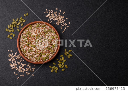 Shelled sunflower, sesame, pumpkin, and flaxseed kernels as ingredients for healthy food 136973413