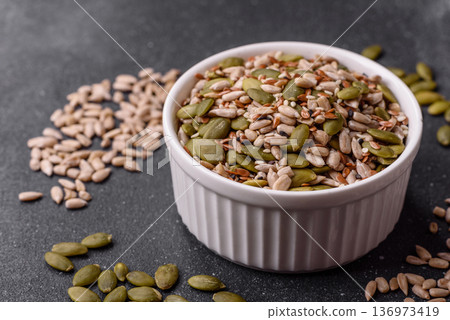 Shelled sunflower, sesame, pumpkin, and flaxseed kernels as ingredients for healthy food Shelled sunflower, sesame, pumpkin, and flaxseed kernels as ingredients for healthy food 136973419