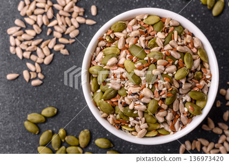 Shelled sunflower, sesame, pumpkin, and flaxseed kernels as ingredients for healthy food Shelled sunflower, sesame, pumpkin, and flaxseed kernels as ingredients for healthy food 136973420