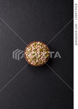 Shelled sunflower, sesame, pumpkin, and flaxseed kernels as ingredients for healthy food 136973428