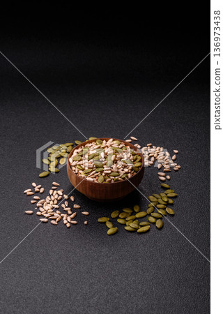 Shelled sunflower, sesame, pumpkin, and flaxseed kernels as ingredients for healthy food Shelled sunflower, sesame, pumpkin, and flaxseed kernels as ingredients for healthy food 136973438