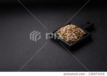 Shelled sunflower, sesame, pumpkin, and flaxseed kernels as ingredients for healthy food 136973439