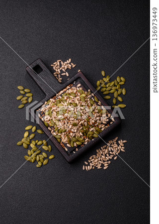Shelled sunflower, sesame, pumpkin, and flaxseed kernels as ingredients for healthy food 136973449