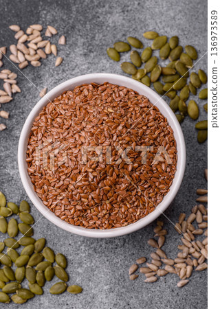 Flaxseed as an ingredient for oil, organic flour, and healthy foods. Flax seeds Flaxseed as an ingredient for oil, organic flour, and healthy foods. Flax seeds 136973589