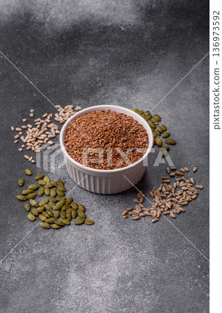 Flaxseed as an ingredient for oil, organic flour, and healthy foods. Flax seeds Flaxseed as an ingredient for oil, organic flour, and healthy foods. Flax seeds 136973592
