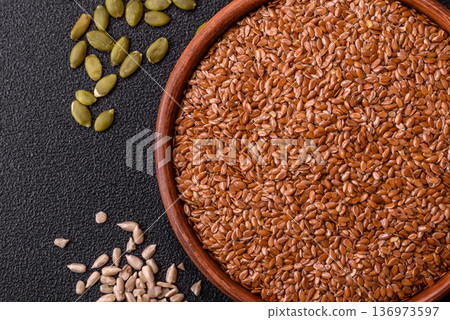 Flaxseed as an ingredient for oil, organic flour, and healthy foods. Flax seeds Flaxseed as an ingredient for oil, organic flour, and healthy foods. Flax seeds 136973597