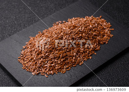 Flaxseed as an ingredient for oil, organic flour, and healthy foods. Flax seeds Flaxseed as an ingredient for oil, organic flour, and healthy foods. Flax seeds 136973609