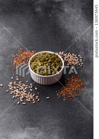 Shelled pumpkin seed kernels, salted, roasted, or raw, are a healthy ingredient. Pumpkin seeds Shelled pumpkin seed kernels, salted, roasted, or raw, are a healthy ingredient. Pumpkin seeds 136973645