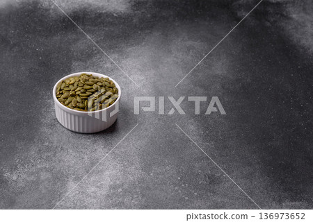 Shelled pumpkin seed kernels, salted, roasted, or raw, are a healthy ingredient. Pumpkin seeds Shelled pumpkin seed kernels, salted, roasted, or raw, are a healthy ingredient. Pumpkin seeds 136973652