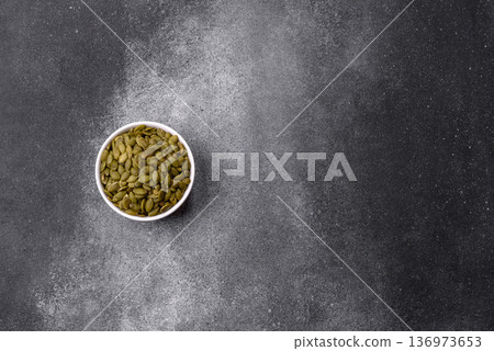 Shelled pumpkin seed kernels, salted, roasted, or raw, are a healthy ingredient. Pumpkin seeds Shelled pumpkin seed kernels, salted, roasted, or raw, are a healthy ingredient. Pumpkin seeds 136973653
