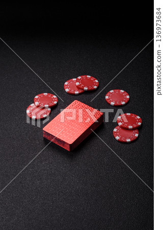 Casino, cards and chips on a colored background, poker and blackjack. Cards and chips 136973684