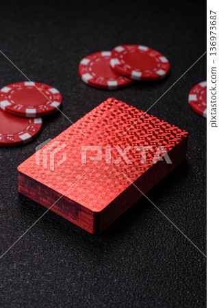 Casino, cards and chips on a colored background, poker and blackjack. Cards and chips Casino, cards and chips on a colored background, poker and blackjack. Cards and chips 136973687