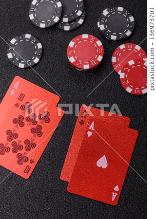 Casino, cards and chips on a colored background, poker and blackjack. Cards and chips Casino, cards and chips on a colored background, poker and blackjack. Cards and chips 136973701