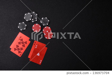 Casino, cards and chips on a colored background, poker and blackjack. Cards and chips 136973704