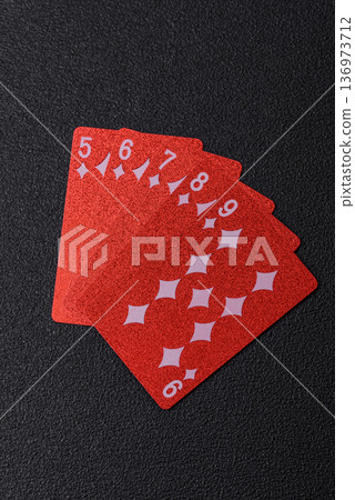 Casino, cards and chips on a colored background, poker and blackjack. Cards and chips 136973712