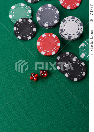 Casino dice and chips on a colored background, poker, gambling with bets. Dice and chips Casino dice and chips on a colored background, poker, gambling with bets. Dice and chips 136973757
