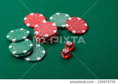 Casino dice and chips on a colored background, poker, gambling with bets. Dice and chips Casino dice and chips on a colored background, poker, gambling with bets. Dice and chips 136973759