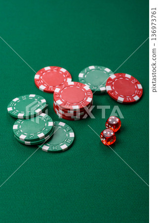 Casino dice and chips on a colored background, poker, gambling with bets. Dice and chips Casino dice and chips on a colored background, poker, gambling with bets. Dice and chips 136973761