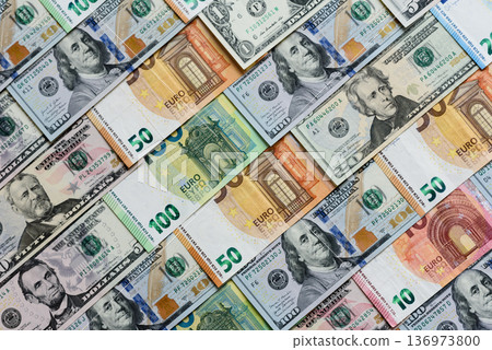 Euro and dollar banknotes, exchange, sales, economic tariffs and taxes. Euros and dollars Euro and dollar banknotes, exchange, sales, economic tariffs and taxes. Euros and dollars 136973800