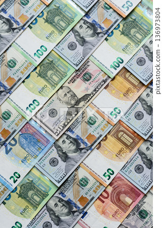 Euro and dollar banknotes, exchange, sales, economic tariffs and taxes. Euros and dollars 136973804