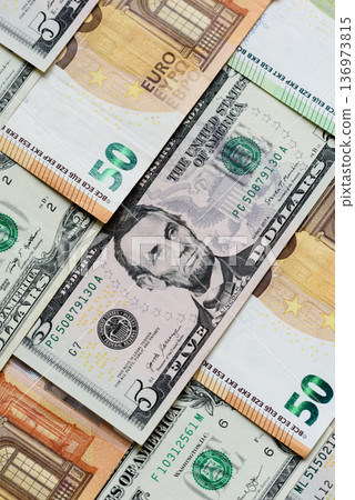 Euro and dollar banknotes, exchange, sales, economic tariffs and taxes. Euros and dollars Euro and dollar banknotes, exchange, sales, economic tariffs and taxes. Euros and dollars 136973815