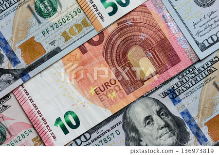 Euro and dollar banknotes, exchange, sales, economic tariffs and taxes. Euros and dollars 136973819