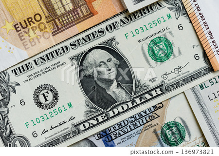 Euro and dollar banknotes, exchange, sales, economic tariffs and taxes. Euros and dollars Euro and dollar banknotes, exchange, sales, economic tariffs and taxes. Euros and dollars 136973821