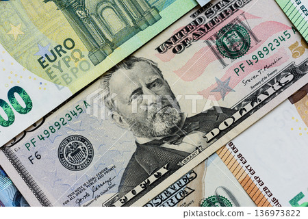 Euro and dollar banknotes, exchange, sales, economic tariffs and taxes. Euros and dollars Euro and dollar banknotes, exchange, sales, economic tariffs and taxes. Euros and dollars 136973822