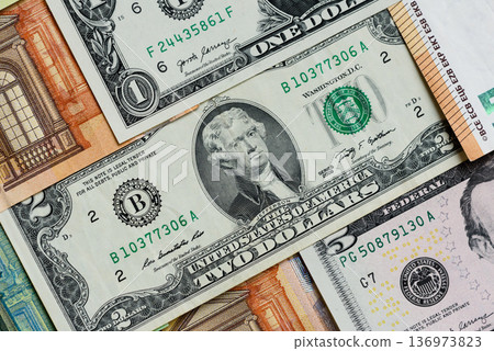 Euro and dollar banknotes, exchange, sales, economic tariffs and taxes. Euros and dollars Euro and dollar banknotes, exchange, sales, economic tariffs and taxes. Euros and dollars 136973823