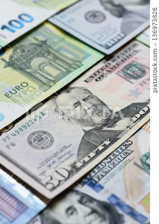 Euro and dollar banknotes, exchange, sales, economic tariffs and taxes. Euros and dollars Euro and dollar banknotes, exchange, sales, economic tariffs and taxes. Euros and dollars 136973826