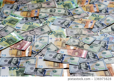 Euro and dollar banknotes, exchange, sales, economic tariffs and taxes. Euros and dollars Euro and dollar banknotes, exchange, sales, economic tariffs and taxes. Euros and dollars 136973828