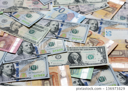 Euro and dollar banknotes, exchange, sales, economic tariffs and taxes. Euros and dollars Euro and dollar banknotes, exchange, sales, economic tariffs and taxes. Euros and dollars 136973829