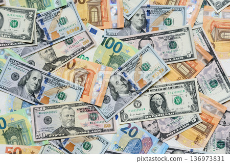 Euro and dollar banknotes, exchange, sales, economic tariffs and taxes. Euros and dollars Euro and dollar banknotes, exchange, sales, economic tariffs and taxes. Euros and dollars 136973831